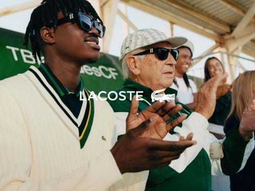 Lacoste young man and elderly man watching tennis